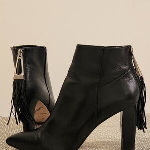 Sleek Black Boots With Tassel Back Zippers